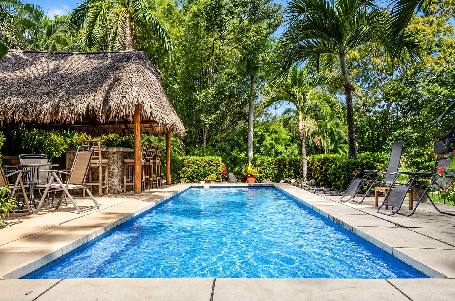 The pool with the thatched rancho at its end