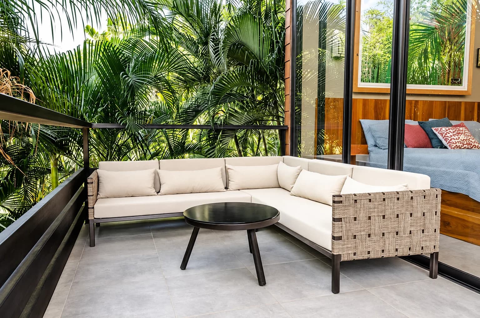 The terrace sofa looking out over the palms