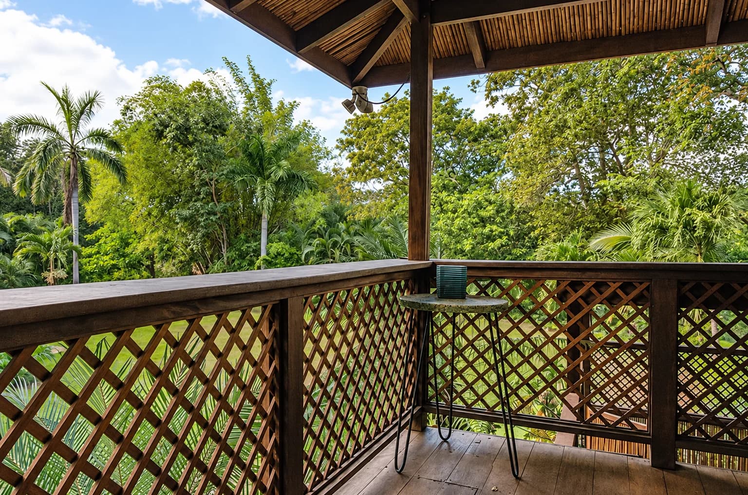The balcony looking out over open green pasture